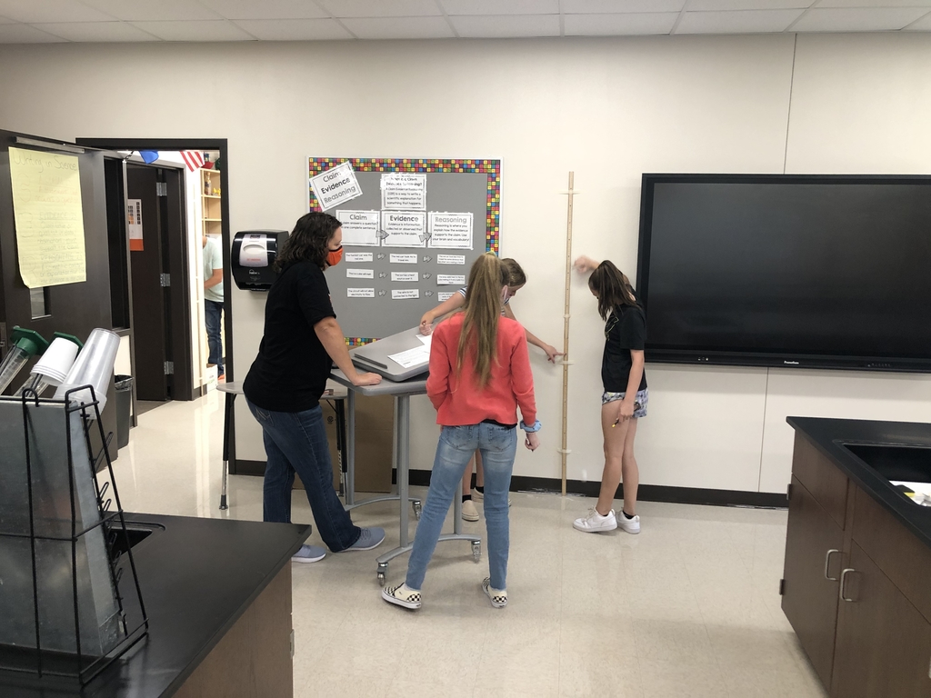 Mrs. Pettijohn guiding her 8th graders